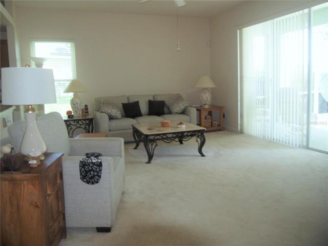 Family room opens to large screen enclosure