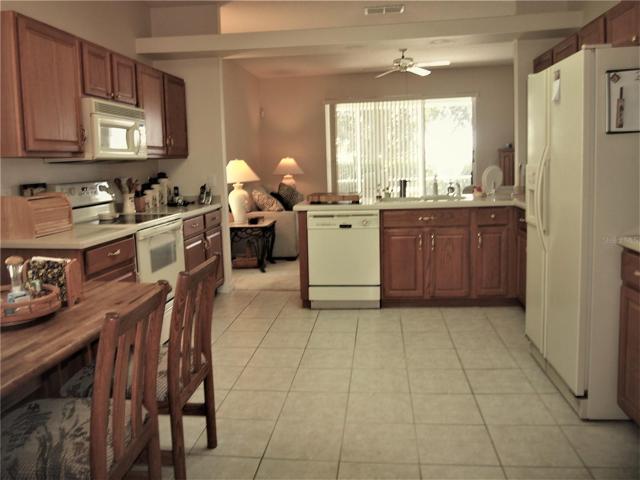 Kitchen has wood cabinetry