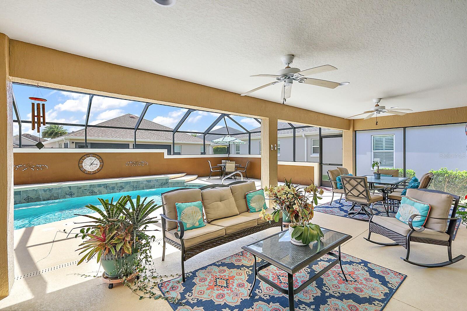 Lanai opens to birdcaged pool area