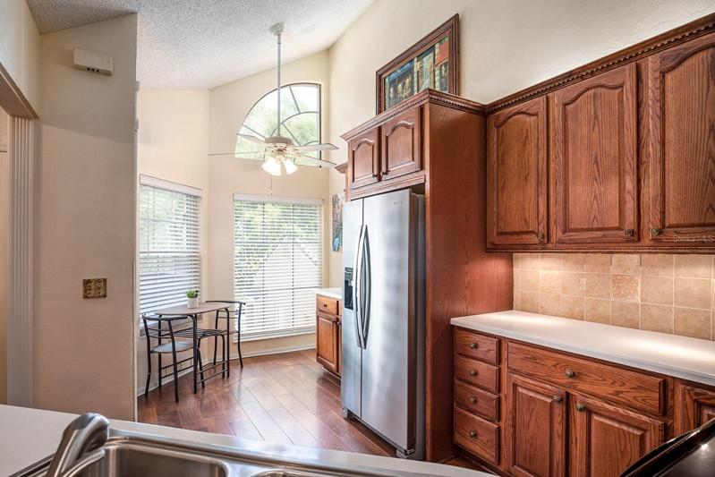 ENGINEERED WOOD wide plank flooring adds the regal touch. Plenty of space for cozy meals in the eat in kitchen .  An abundance of light beams through this home. Palladian windows add a high end touch to this space.