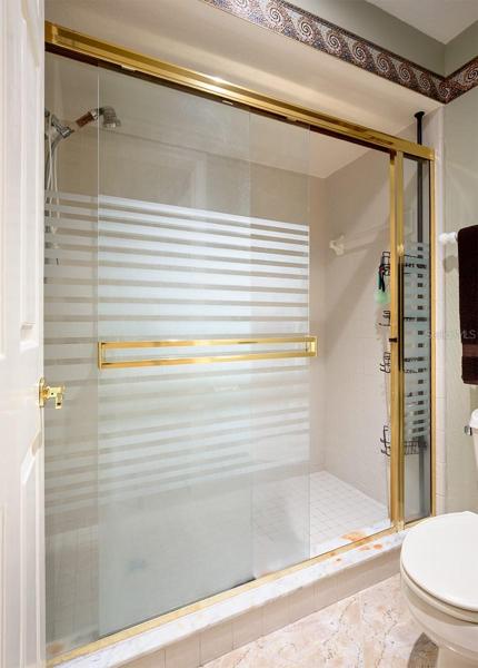 Oversized walk in shower and lots of closet and cabinet space in your spa like master  bathroom