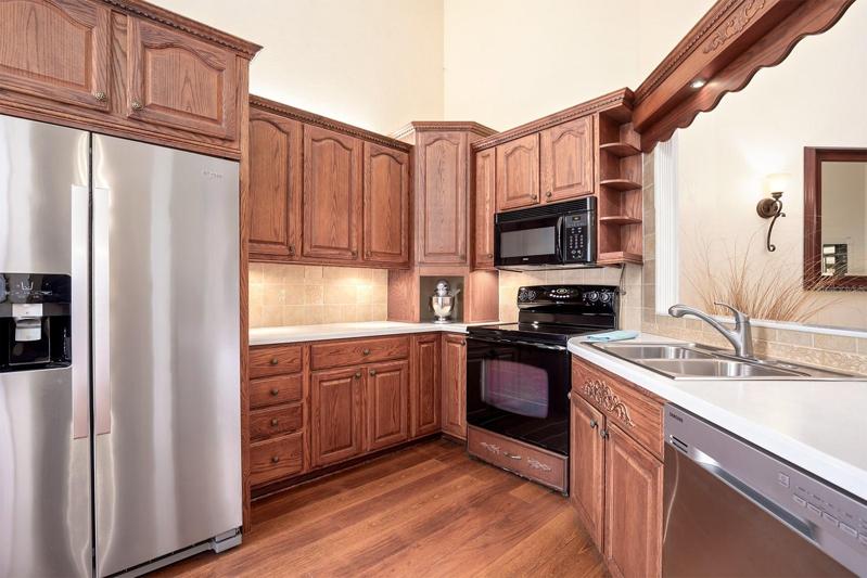 Create CULINARY masterpieces in ease with an abundance of CUSTOM crafted CABINETRY, STAINLESS STEEL appliances and CORIAN counters with plenty of prep space, eat in area and loads of storage space