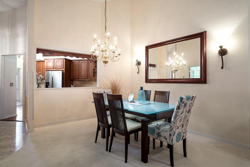 Formal Dining room for larger gatherings.  Oversized pass-through opening for serving formal meals and making entertaining a breeze.