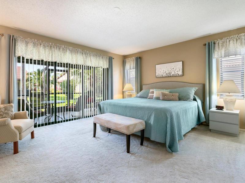Bedroom 1 has sliding glass doors to the lanai