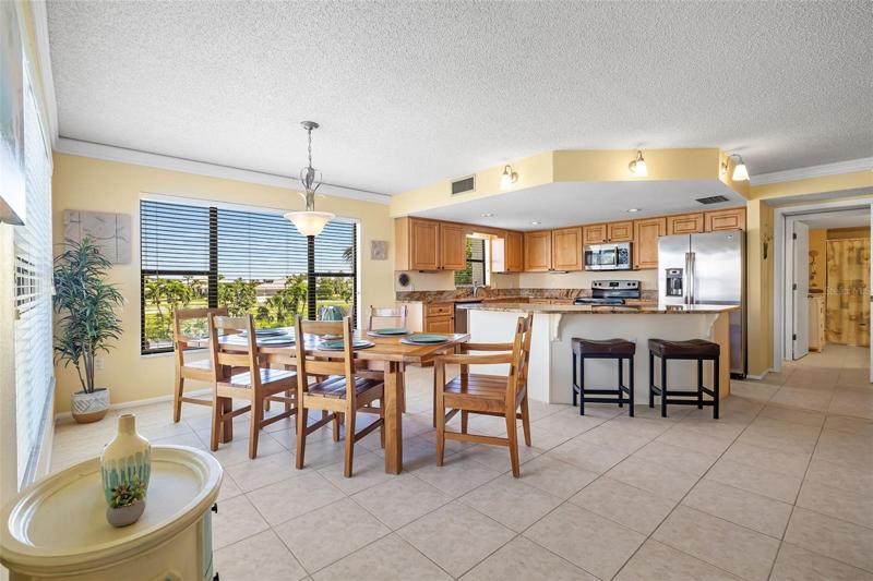 Dining Area to Kitchen. Guest bath in the background.