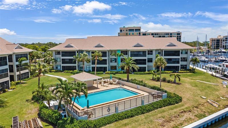 Pool Adjacent to North Yacht Basin canal.  Condo is on 2nd floor on the left side of the building.