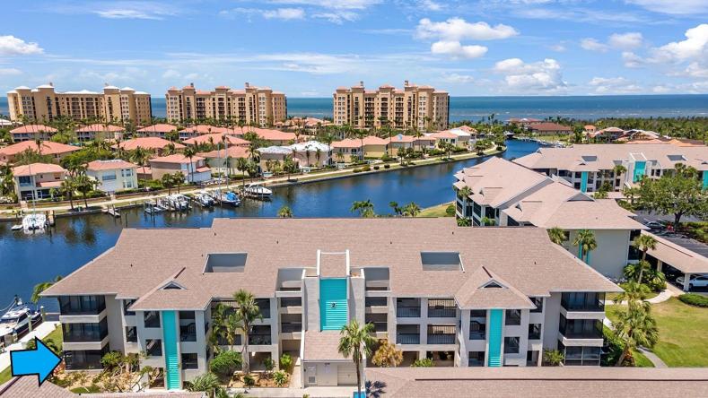 Blue Arrow points to condo.