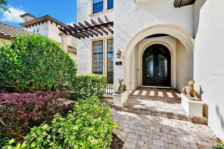 Covered Front Entrance with Copper/Bronze Style Security Door.