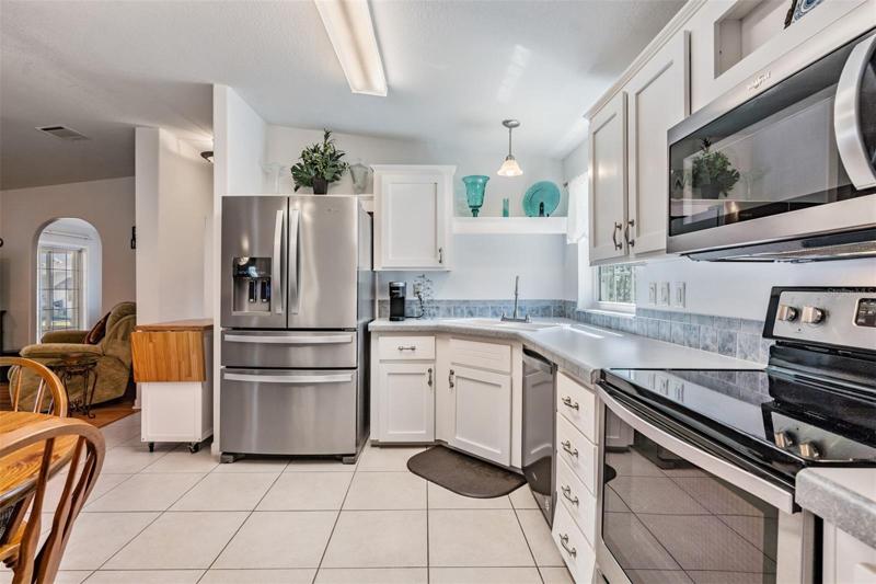 Stainless Appliances and Tile floors in the kitchen