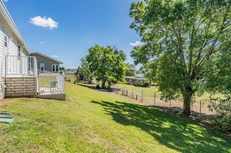 Treed backyard with greenscape views in the valley
