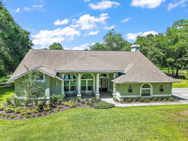 A freshly painted exterior and extensive landscaping makes this home the definition of a Trophy Property