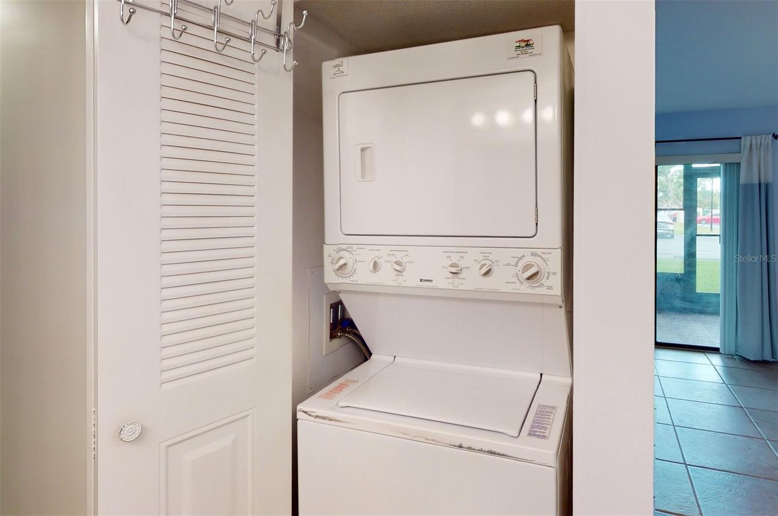 Washer and dryer in master closet.