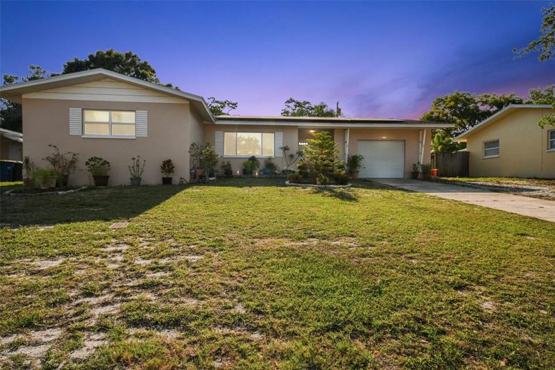 Front view with large driveway