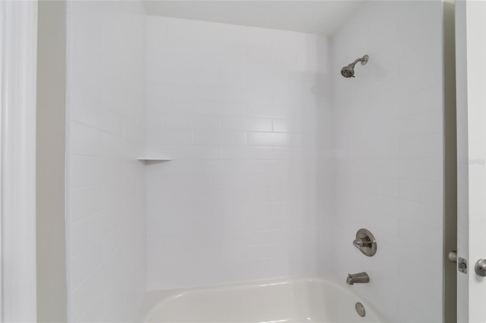 Tiled guest bath tub/shower
