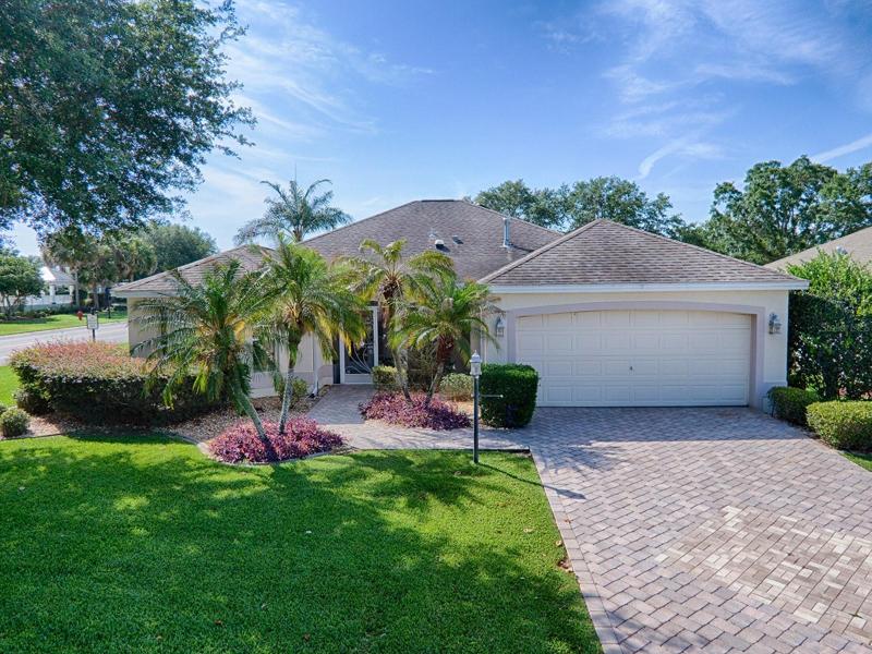 LOVELY 3/2 ROYAL PALM DESIGNER HOME ON A CORNER HOMESITE IN THE VILLAGE OF CALUMET GROVE.