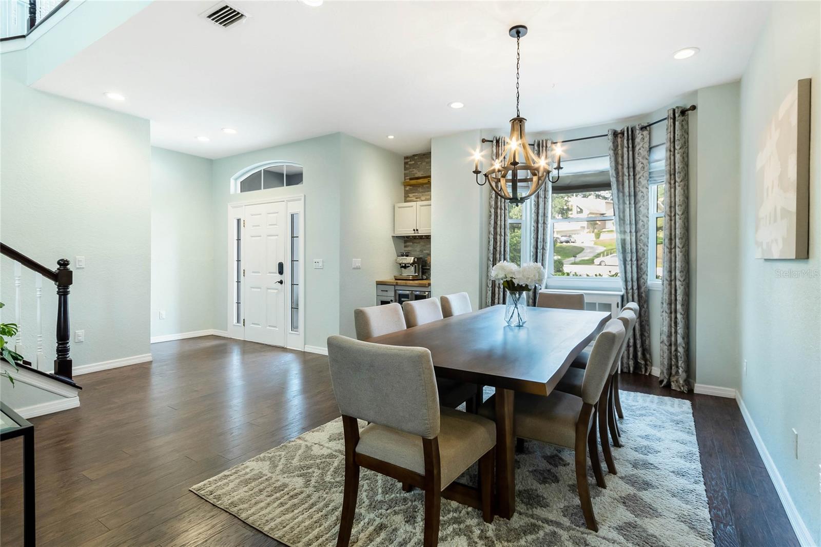 Entryway features a formal dining space and coffee/wine nook