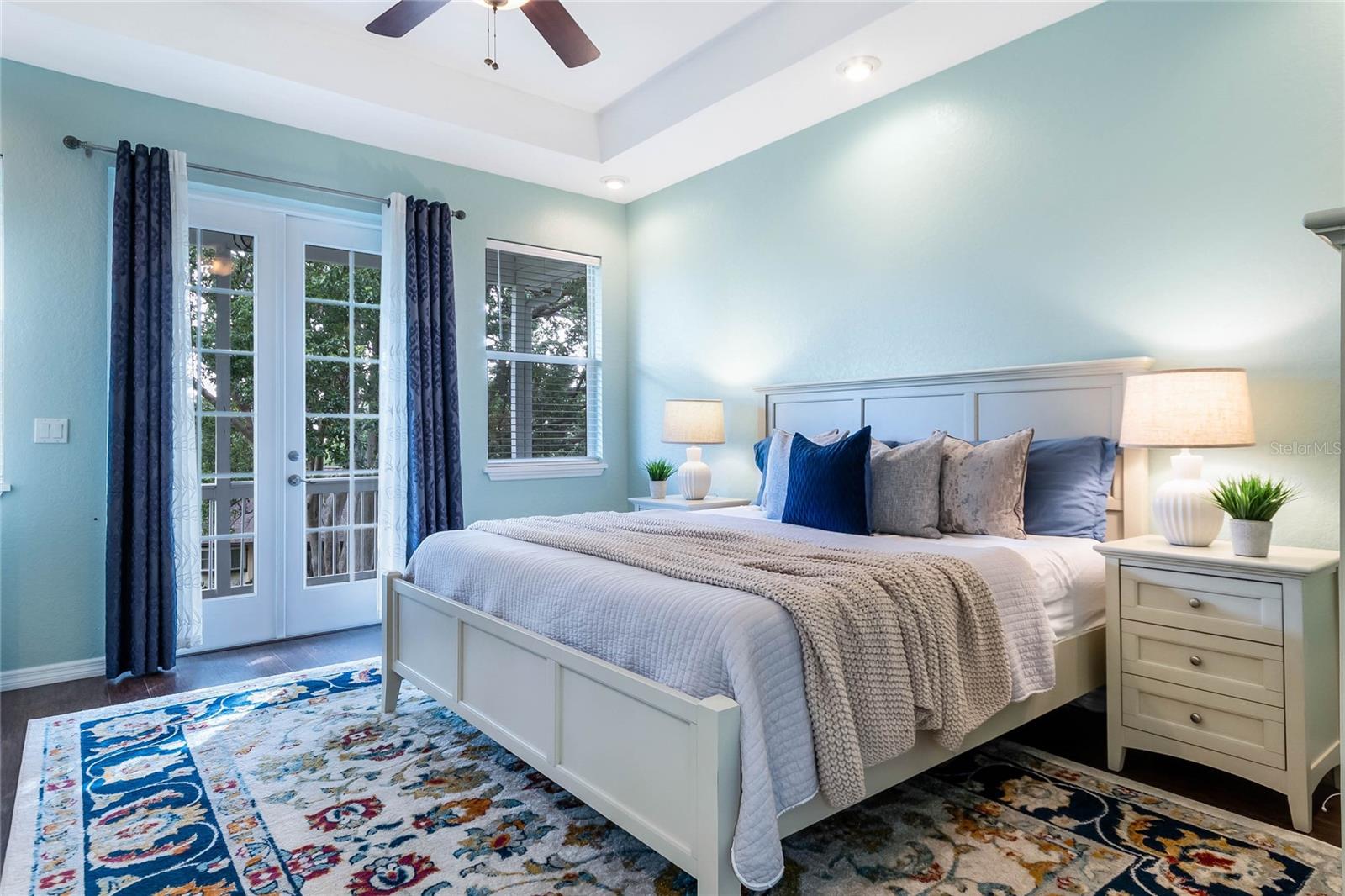 Primary Bedroom (Main Level) with French Doors to Balcony