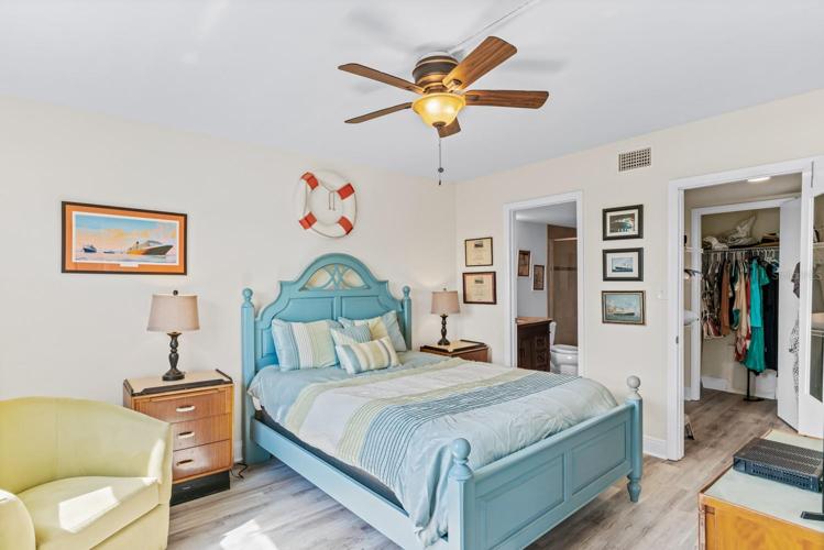 Master bedroom with walk in closet and en suite bathroom