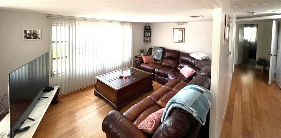 Large Living room with bamboo flooring.