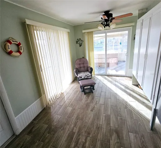 Large Florida room which leads to the back screen area. Also has built in shelves for a possible 4th bedroom