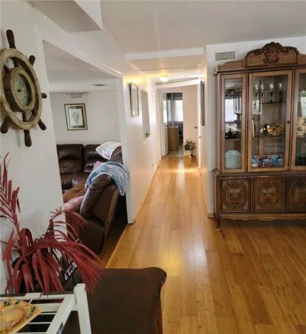 Hallway from the kitchen. Looking toward the master bedroom over looking the canal and porch.