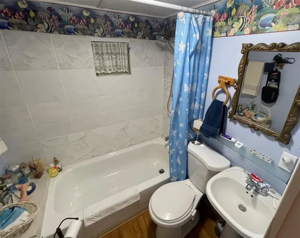 Full Bathroom with tub & shower head.