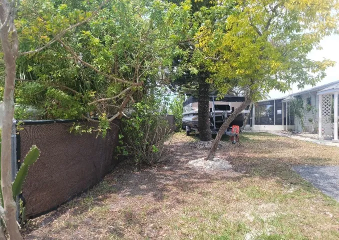 Side yard view from the street looking west.