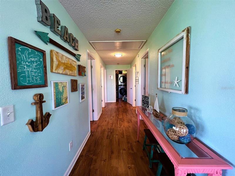 Hallway leading to bedrooms, baths and laundry room