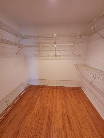 One of 3 walk-in closets