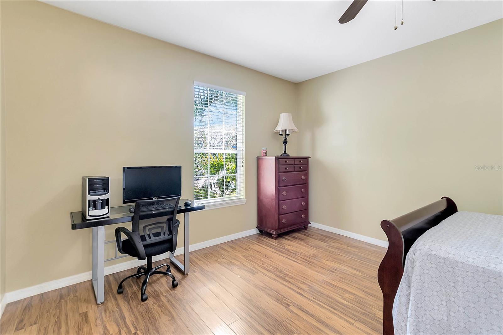 The fourth bedroom, located off the dining room.