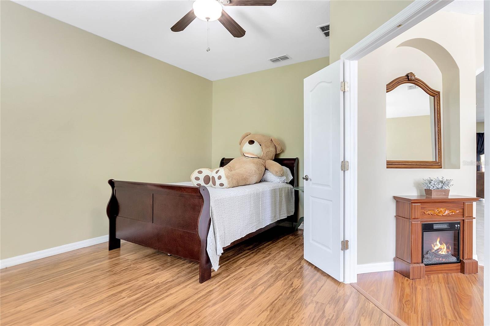 Located off the dining room, this room features a double door entry, making it a versatile space that could be used as an office or guest room.