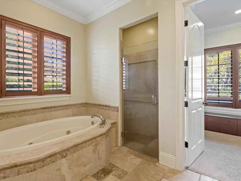 Master bath with large jetted tub and separate shower
