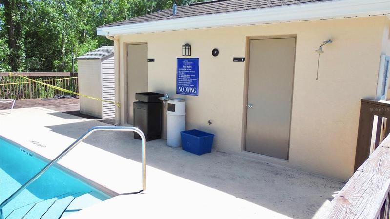 Community pool area with bathrooms