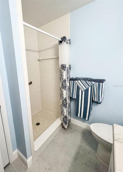 Master bathroom - walk-in shower and new tile flooring