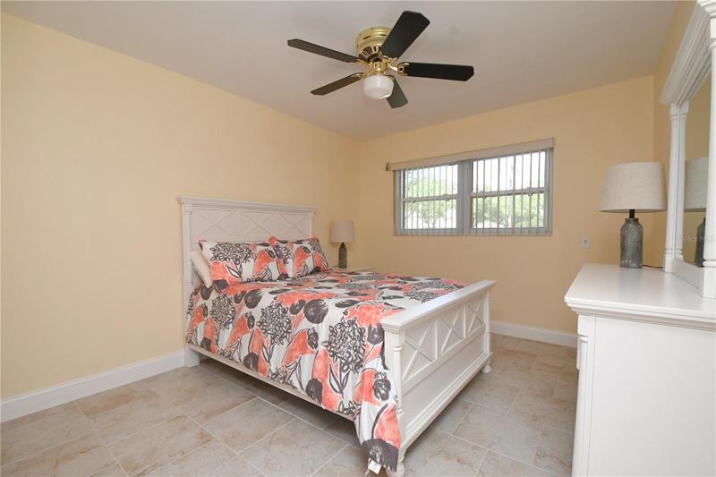 Bedroom #2 - featuring a ceiling fan with a light.
