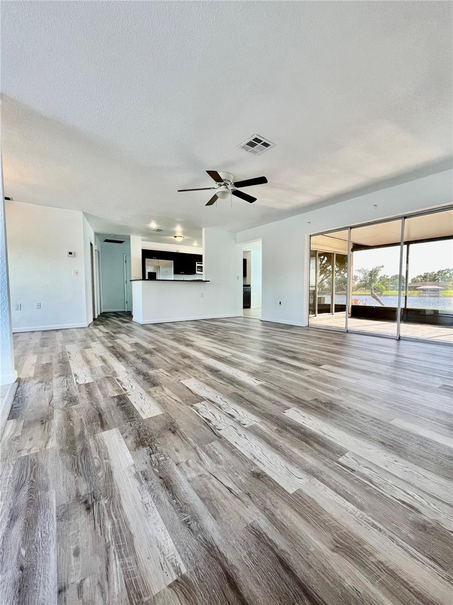 Living Room facing kitchen, dining and patio