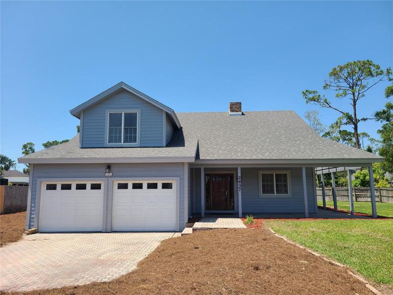 3/2.5/2 with Loft and screened in Lanai with inground Pool on .39 acres