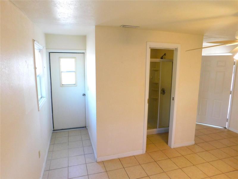 door leading to backyard and laundry