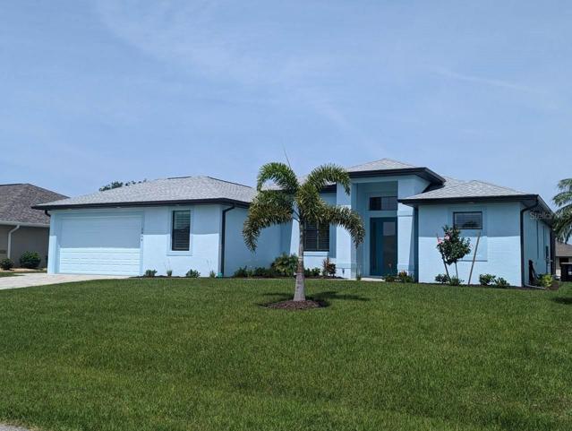 the home has beautiful curb appeal from the moment you pull in the paver covered drive.  The garden is beautifully landscaped.