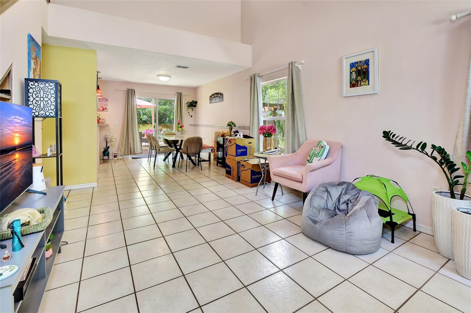 Entry with view of living and dining room through to back yard