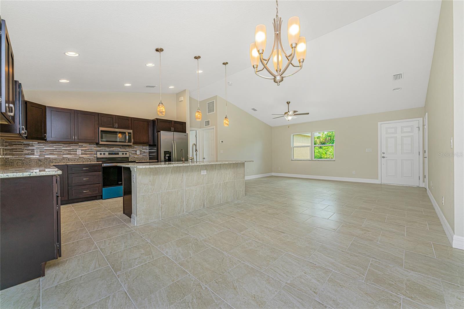 Photos are of same floor plan with similar finishes.