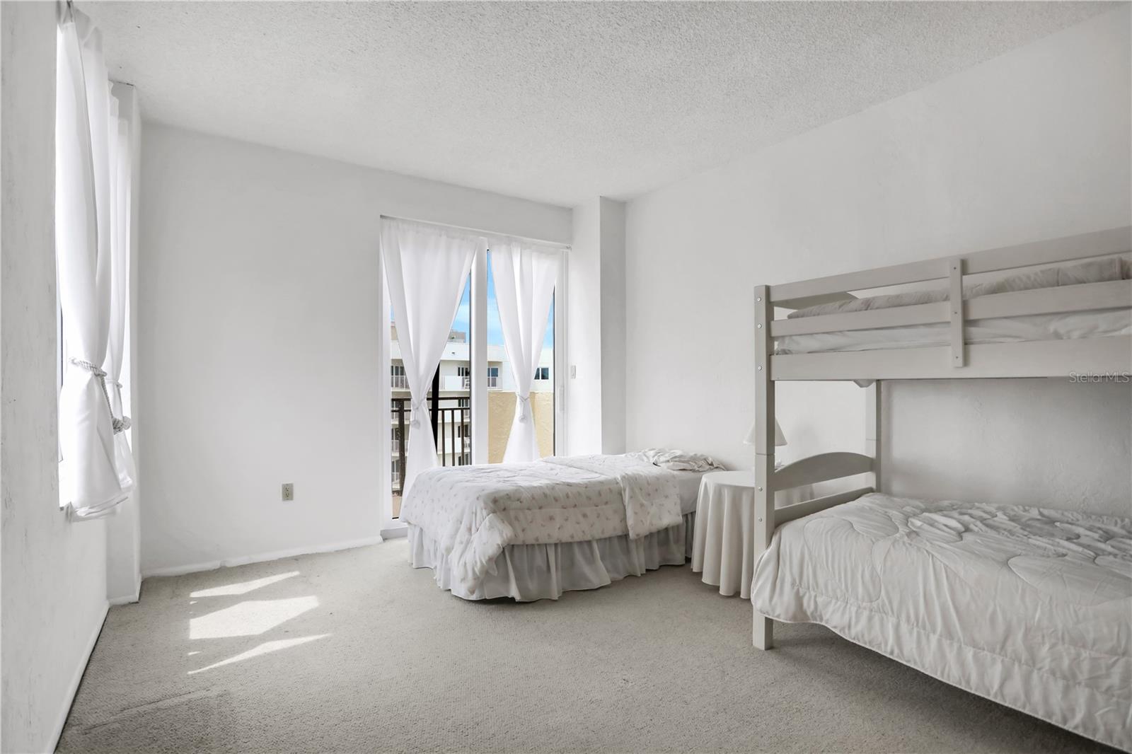 Upstairs bedroom #2 with balcony access