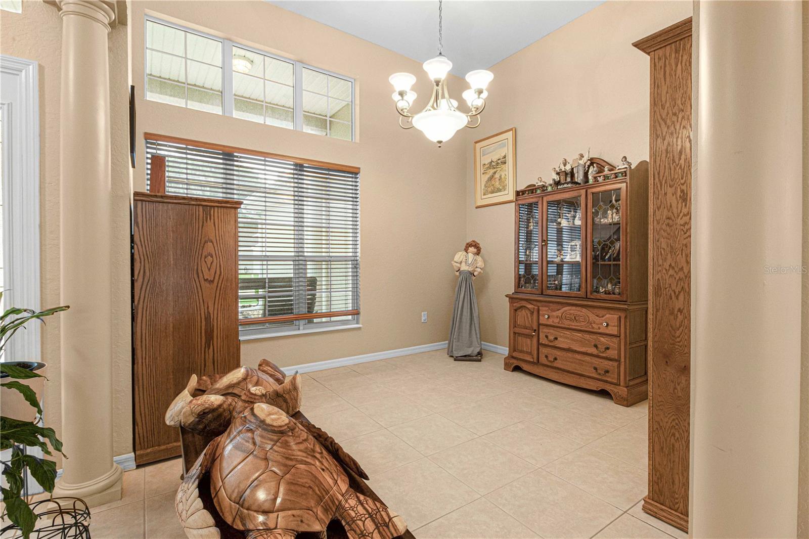 Formal dining room, high ceiling, large window, tiles flooring, lighting, great space for your dining room table &amp; buffet table.