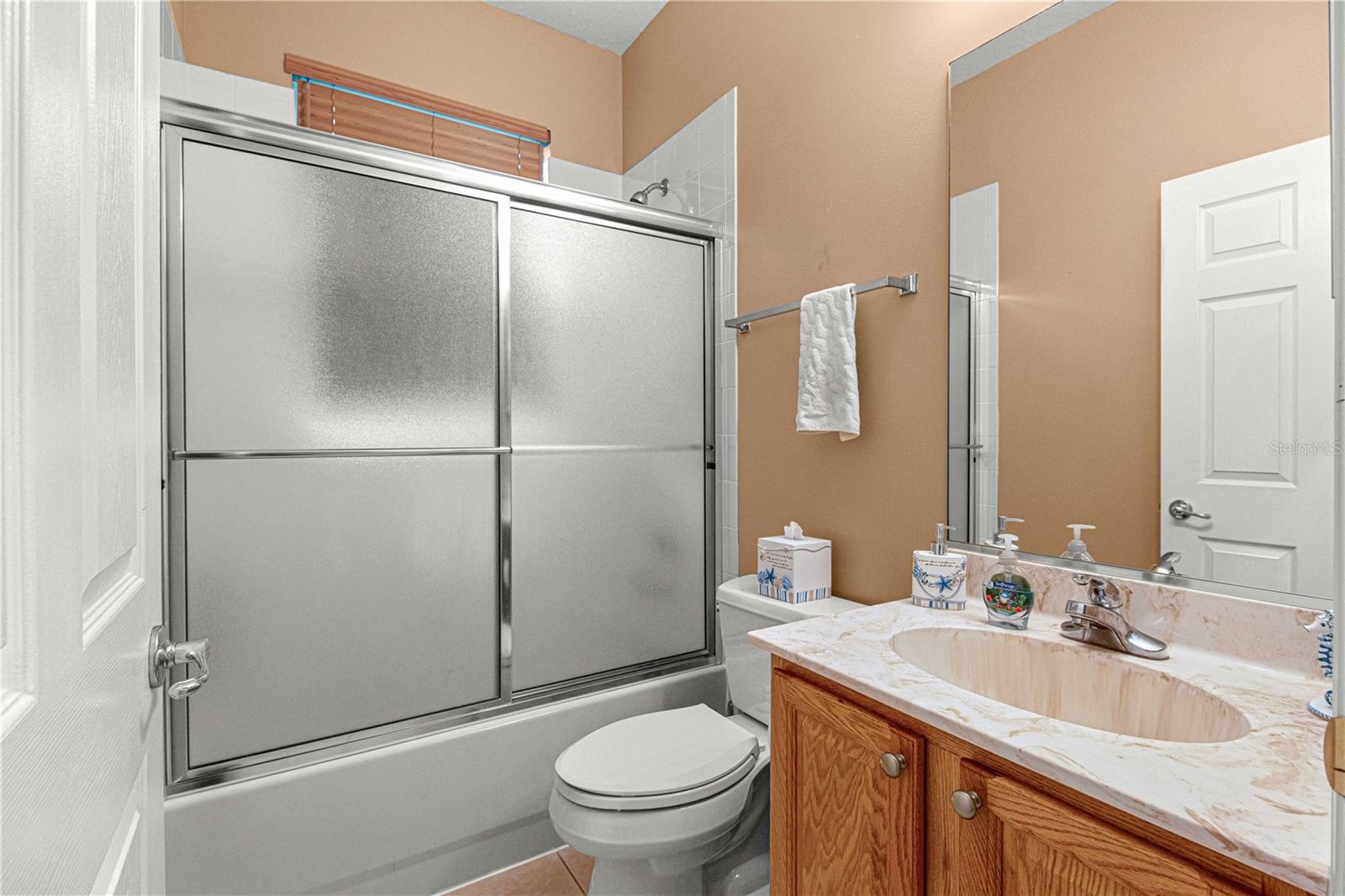 Full bathroom tub/shower between the guest bedrooms.