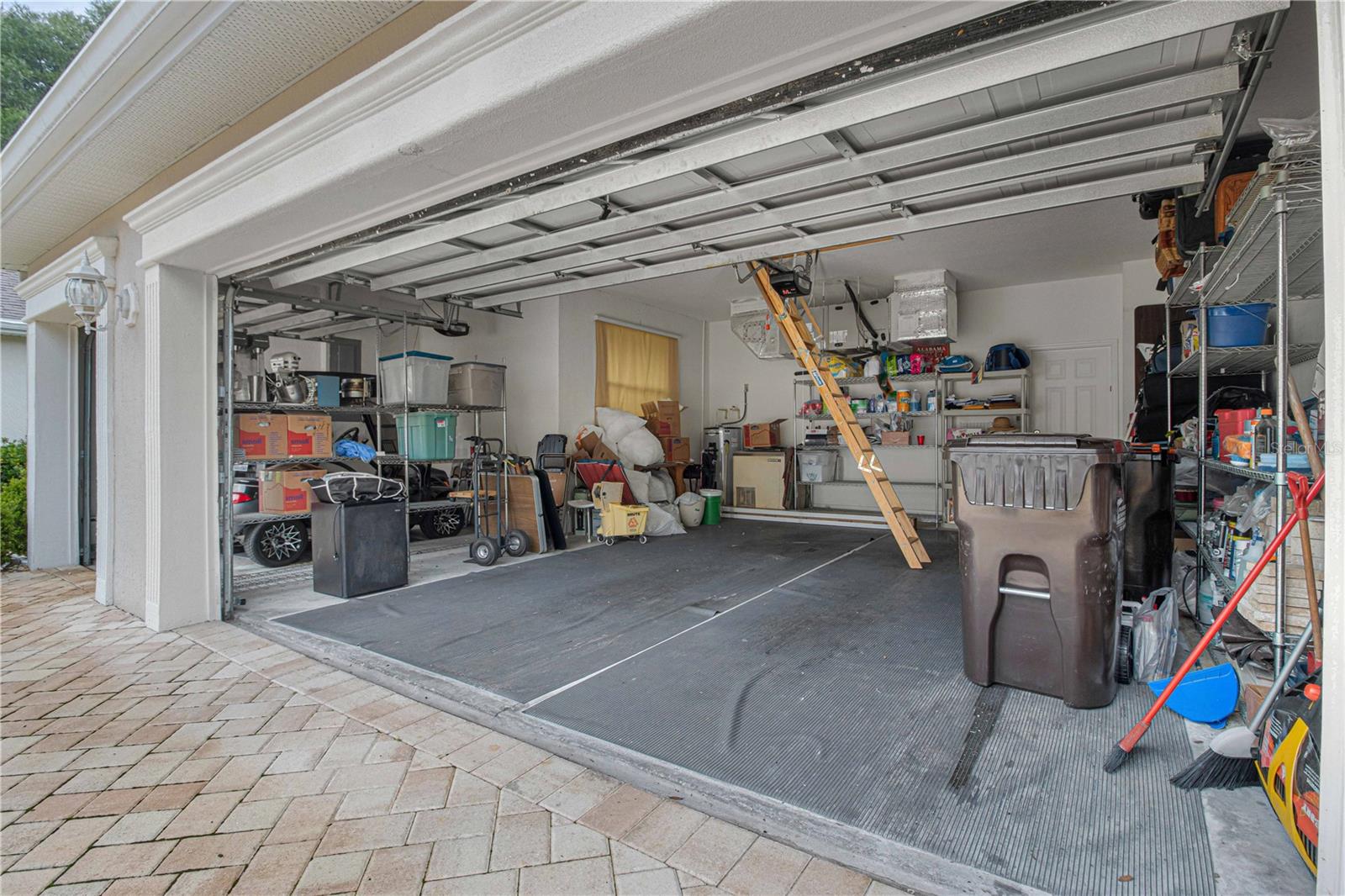 What you been dreaming of; 2-car garage with separate 1-golf cart garage, plenty of space and storage inside the garage.