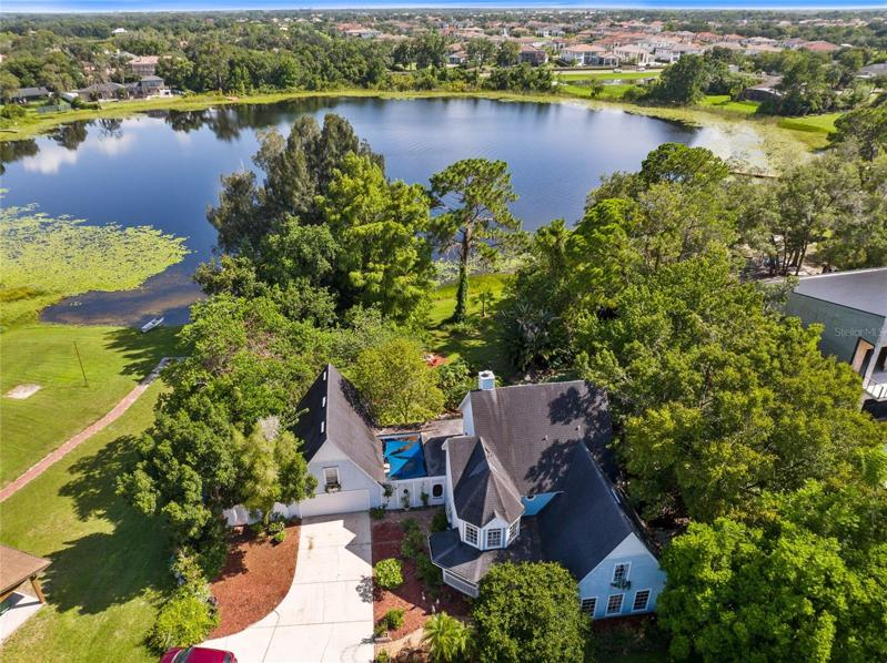 LIVE THE FLORIDA LIFESTYLE you’ve always dreamed of! Situated on private Lake Buynak and featuring almost TWO ACRES of land, this STUNNING home has it all.