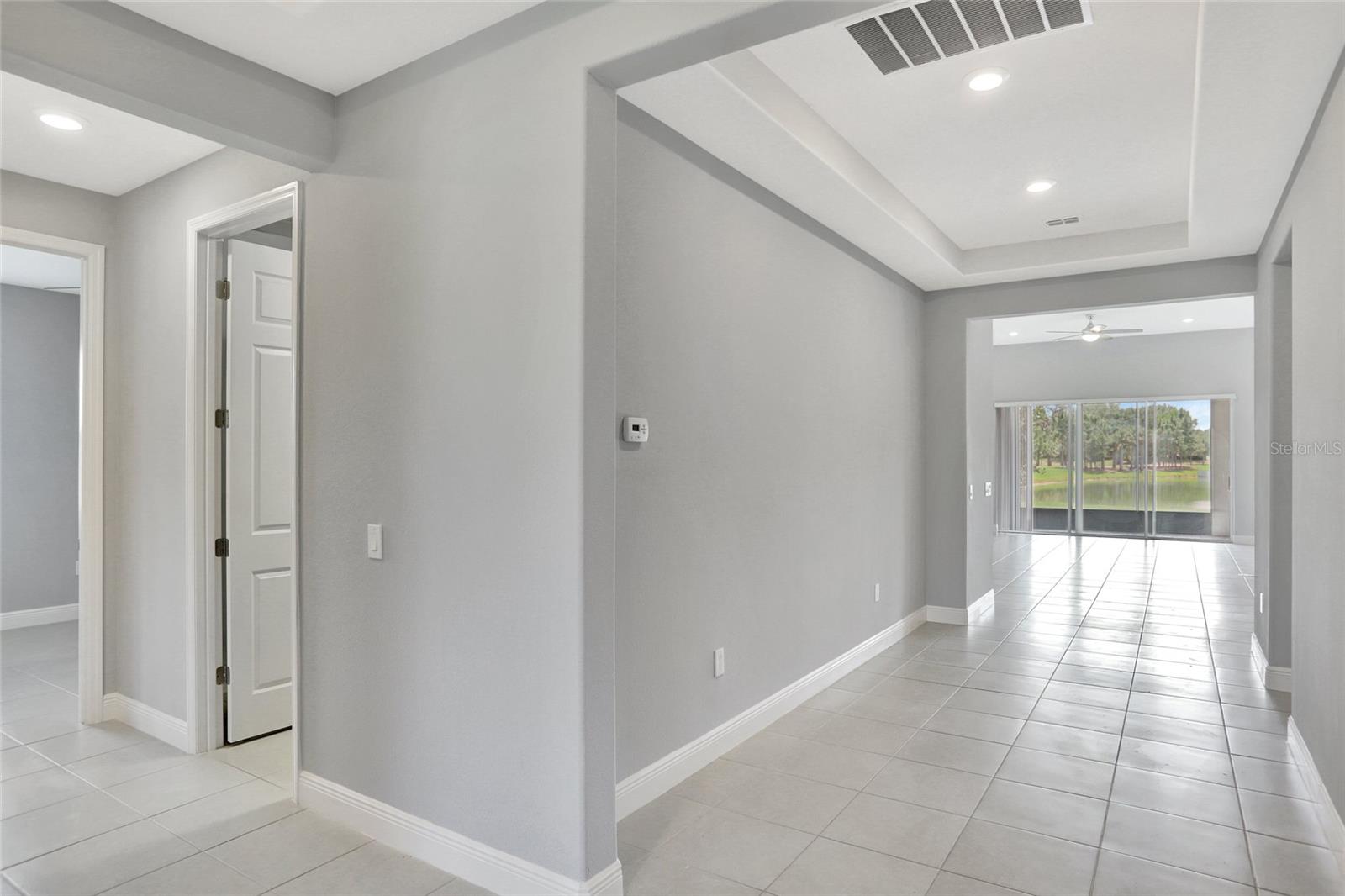 Hallway with bedroom 1 and 2 to the left, family room etc. to the right