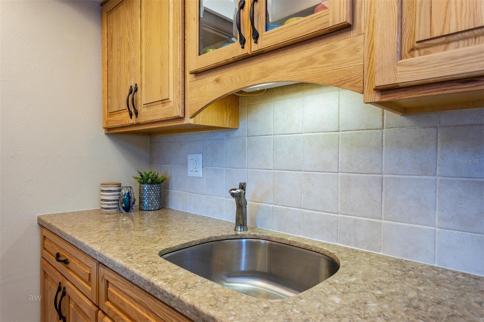 Granite countertops and tiled backsplash