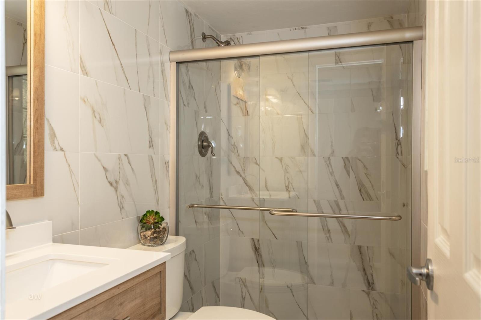 1st Floor bathroom has fully tiled walls. Beautiful!!
