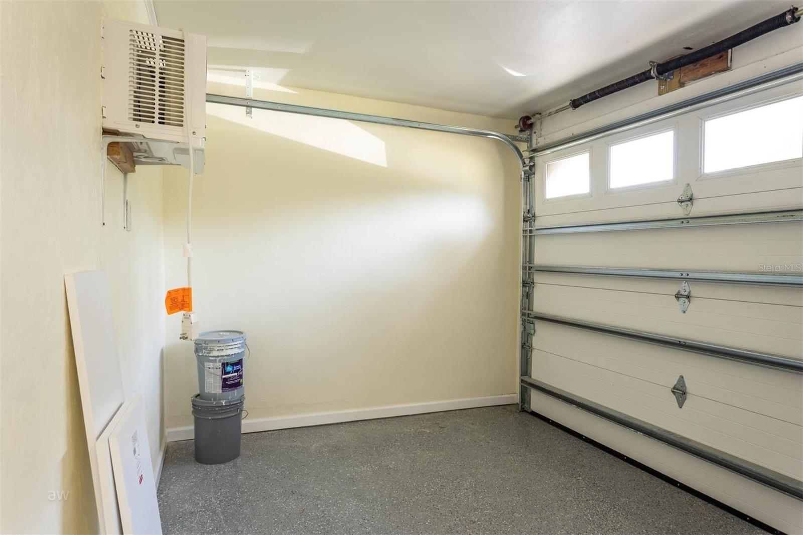 Mini garage area is great for a golf cart, bikes, beach chairs and storage.